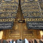 Pilgrims gather at the ornate door of the Kaaba in Mecca, Saudi Arabia.